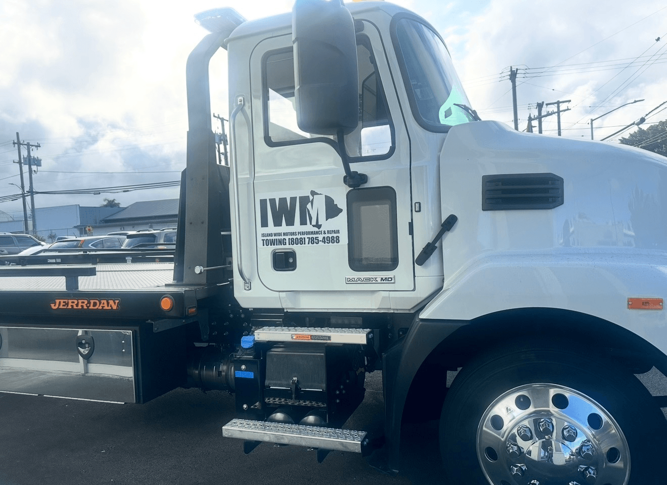 Island Wide Motors tow truck showing the IWM logo